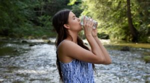 girl drinking fresh spring water