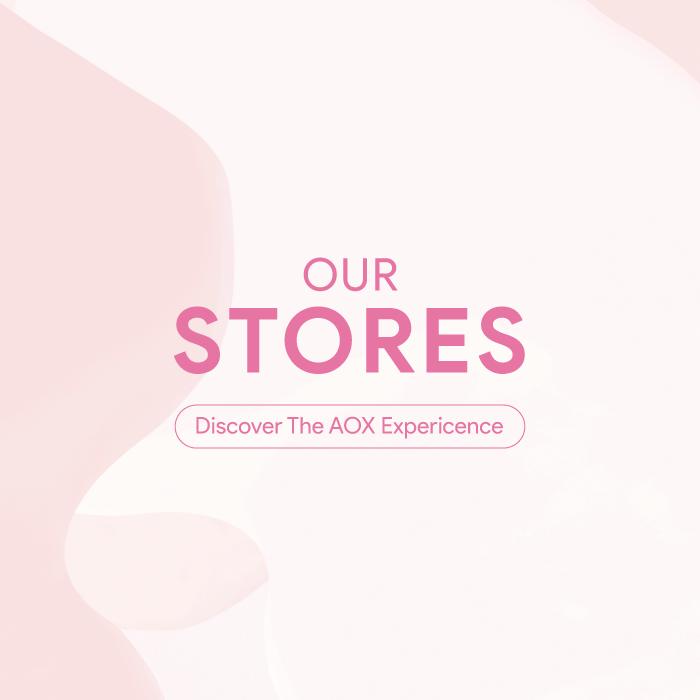 Our Stores - Discover the AOX Experience' in pink against a soft abstract pastel background.