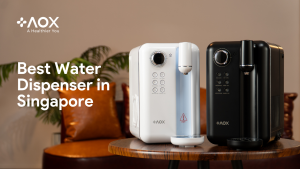AOX white and black water dispensers on a wooden table in a stylish Singapore home, highlighting the best water dispenser choice for 2025.
