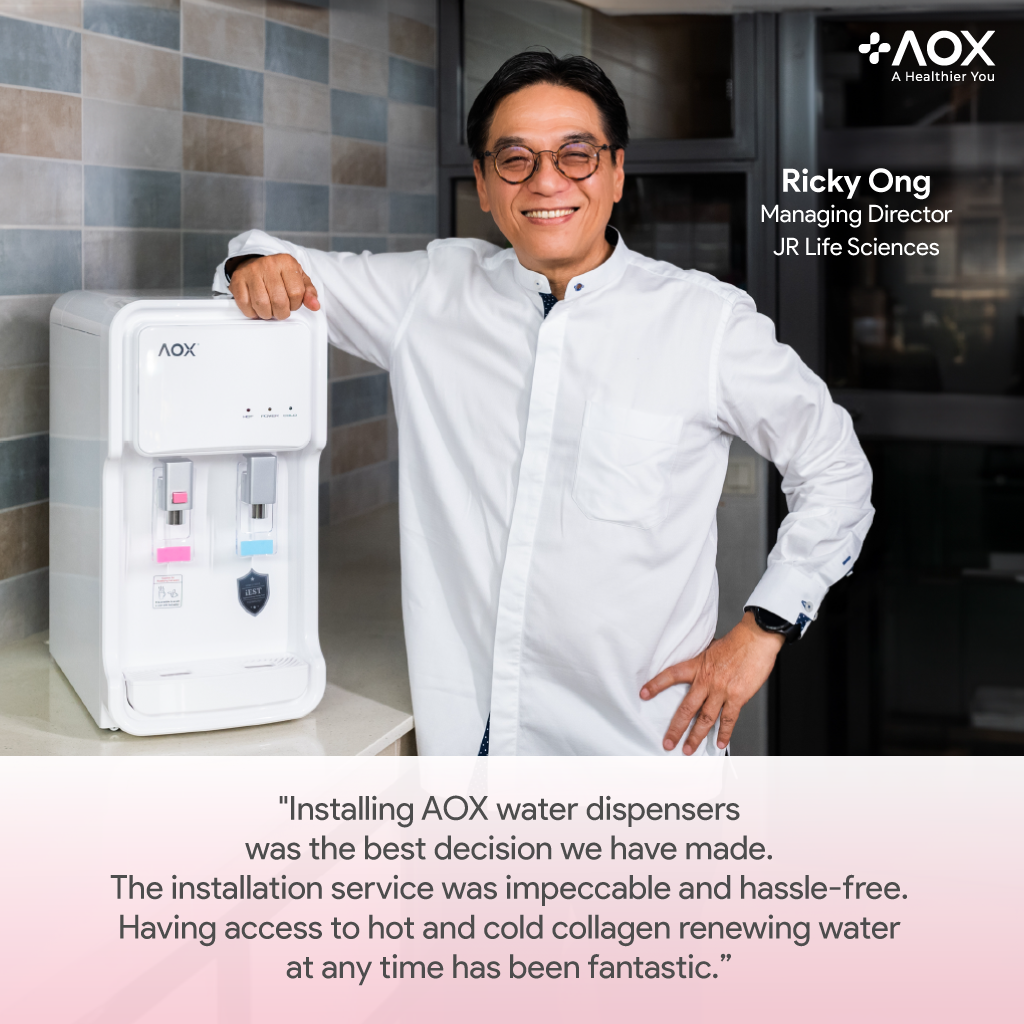 Ricky Ong, Managing Director of JR Life Sciences, with AOX water dispenser sharing a testimonial about hassle-free installation and collagen-renewing water benefits.